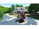 Community clubhouse exterior featuring stone and siding accents with surrounding landscape at 621 Oakbourne Way, Woodstock, GA 30188