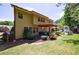 Spacious two-story home exterior with a large backyard, patio area, and lush greenery, perfect for outdoor enjoyment at 621 Oakbourne Way, Woodstock, GA 30188