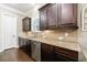 Modern kitchen with granite countertops, stainless steel appliances, and custom cabinets at 621 Oakbourne Way, Woodstock, GA 30188