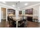 Kitchen features a large center island with barstool seating and custom dark wood cabinets at 621 Oakbourne Way, Woodstock, GA 30188