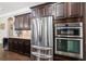 Modern kitchen features stainless steel appliances including refrigerator, microwave, and oven at 621 Oakbourne Way, Woodstock, GA 30188