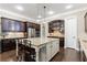Well-equipped kitchen with a large island, modern appliances, and stylish countertops at 621 Oakbourne Way, Woodstock, GA 30188
