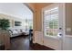 Inviting living room featuring dark hardwood floors, neutral paint, and large windows offering plenty of natural light at 621 Oakbourne Way, Woodstock, GA 30188