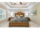 Comfortable main bedroom with tray ceilings, carpet flooring, and natural light at 621 Oakbourne Way, Woodstock, GA 30188