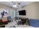 Office space with built-in desk, a ceiling fan, and comfortable seating at 621 Oakbourne Way, Woodstock, GA 30188