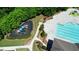 Aerial view of the community playground and pool area surrounded by trees at 621 Oakbourne Way, Woodstock, GA 30188