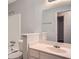 This bathroom features a vanity with sink, commode and shower/tub combo with white tiling at 1515 Barrier Rd, Marietta, GA 30066