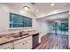 Kitchen area showing granite counters, stainless dishwasher, and view into the adjacent dining area at 1515 Barrier Rd, Marietta, GA 30066