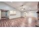 Open-concept living room with wood floors connecting to the kitchen and entry at 1515 Barrier Rd, Marietta, GA 30066