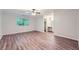 Spacious main bedroom features a ceiling fan, wood-look flooring, and an ensuite bath at 1515 Barrier Rd, Marietta, GA 30066