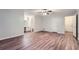 Large main bedroom features wood-look flooring, ceiling fan, and an ensuite bathroom at 1515 Barrier Rd, Marietta, GA 30066
