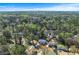 An aerial view of a residential neighborhood surrounded by lush greenery and mature trees at 2373 Sagamore Hills Dr, Decatur, GA 30033