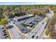 Aerial view of a commercial area with a strip mall, parking lot, and surrounding roads at 2373 Sagamore Hills Dr, Decatur, GA 30033