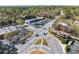 Aerial view of a commercial area with ample parking, surrounded by trees and roads at 2373 Sagamore Hills Dr, Decatur, GA 30033