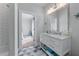 Bathroom with shower, marble vanity, and natural lighting at 2373 Sagamore Hills Dr, Decatur, GA 30033