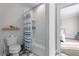 Well-lit bathroom features a shower-tub combo with modern tiling and neutral colored walls at 2373 Sagamore Hills Dr, Decatur, GA 30033