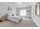 Cozy bedroom with a soft bed, decorative mirror, and ample natural light at 2373 Sagamore Hills Dr, Decatur, GA 30033