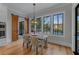 Bright breakfast nook featuring a wooden table set, view of the pool and access to the back porch at 2373 Sagamore Hills Dr, Decatur, GA 30033