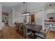 Open dining area with wood floors and elegant decor, adjacent to built-in shelving at 2373 Sagamore Hills Dr, Decatur, GA 30033