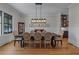 Formal dining room with stylish lighting and wainscoting detail at 2373 Sagamore Hills Dr, Decatur, GA 30033
