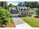 Beautiful two-story home with a landscaped front yard, inviting porch, and brick-paver driveway at 2373 Sagamore Hills Dr, Decatur, GA 30033