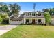Beautiful two-story home with a landscaped front yard, inviting porch, and brick-paver driveway at 2373 Sagamore Hills Dr, Decatur, GA 30033