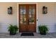 Elegant double front doors flanked by decorative lanterns and potted plants at 2373 Sagamore Hills Dr, Decatur, GA 30033
