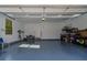 Spacious garage with epoxy flooring, overhead lighting and storage shelving at 2373 Sagamore Hills Dr, Decatur, GA 30033