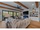 Cozy living room with exposed wood beams, fireplace, and sliding doors to the exterior at 2373 Sagamore Hills Dr, Decatur, GA 30033