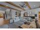 Open-concept living area featuring wood floors, exposed beams, and an inviting sectional sofa at 2373 Sagamore Hills Dr, Decatur, GA 30033