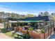 Inviting outdoor seating at The Grove with lush plants, shaded areas, and a cozy ambiance at 2373 Sagamore Hills Dr, Decatur, GA 30033