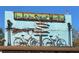 Sign for the Irwin Street Market with directions to local attractions and vintage bicycle decorations at 260 Estoria St, Atlanta, GA 30316