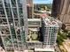 Stunning aerial view of the community featuring lush landscaping, pool, and modern architecture at 40 12Th Ne St # 803, Atlanta, GA 30309