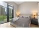 Serene bedroom with large windows offering city views and a comfortable, neutral color scheme at 40 12Th Ne St # 803, Atlanta, GA 30309