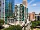 Modern high-rise building with balconies and green accents, offering city views at 40 12Th Ne St # 803, Atlanta, GA 30309