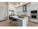 Modern kitchen features white cabinets, stainless steel appliances, and a quartz countertop island at 40 12Th Ne St # 803, Atlanta, GA 30309