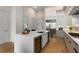 Contemporary kitchen featuring a wine fridge, stainless appliances, and a quartz countertop island at 40 12Th Ne St # 803, Atlanta, GA 30309