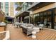 Stylish outdoor lounge with modern furniture, barbecue grill, and city backdrop at 40 12Th Ne St # 803, Atlanta, GA 30309