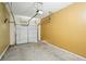 A single-car garage with a yellow wall and a closed white garage door at 5019 Lower Elm St, Atlanta, GA 30349