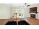 Stylish kitchen faucet and sink with a view of the living room and fireplace at 5019 Lower Elm St, Atlanta, GA 30349