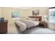 Cozy main bedroom featuring a queen-sized bed and ample natural light at 75 Saltcreek Pt, Sugar Hill, GA 30518