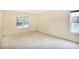 Large primary bedroom with neutral walls and carpet at 75 Saltcreek Pt, Sugar Hill, GA 30518