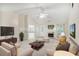 Bright living room boasts vaulted ceilings, a fireplace, and an open layout perfect for entertaining at 75 Saltcreek Pt, Sugar Hill, GA 30518