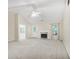 Bright living room boasts vaulted ceilings and a fireplace at 75 Saltcreek Pt, Sugar Hill, GA 30518