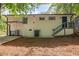 The backyard includes a concrete patio, a staircase, and a back entrance to the home at 2889 Macon Sw Dr, Atlanta, GA 30354