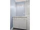 Bathroom featuring a granite countertop, white vanity, and modern lighting fixture at 2889 Macon Sw Dr, Atlanta, GA 30354