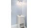 The bathroom features light blue walls, a white vanity, and marble floors at 2889 Macon Sw Dr, Atlanta, GA 30354