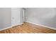 This bedroom features hardwood floors, neutral paint, and a closet space for ample storage at 2889 Macon Sw Dr, Atlanta, GA 30354