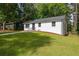 Inviting one-story home with a green lawn and updated exterior at 2889 Macon Sw Dr, Atlanta, GA 30354