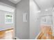 Hallway showcasing hardwood floors, freshly painted walls, and natural light from the windows at 2889 Macon Sw Dr, Atlanta, GA 30354